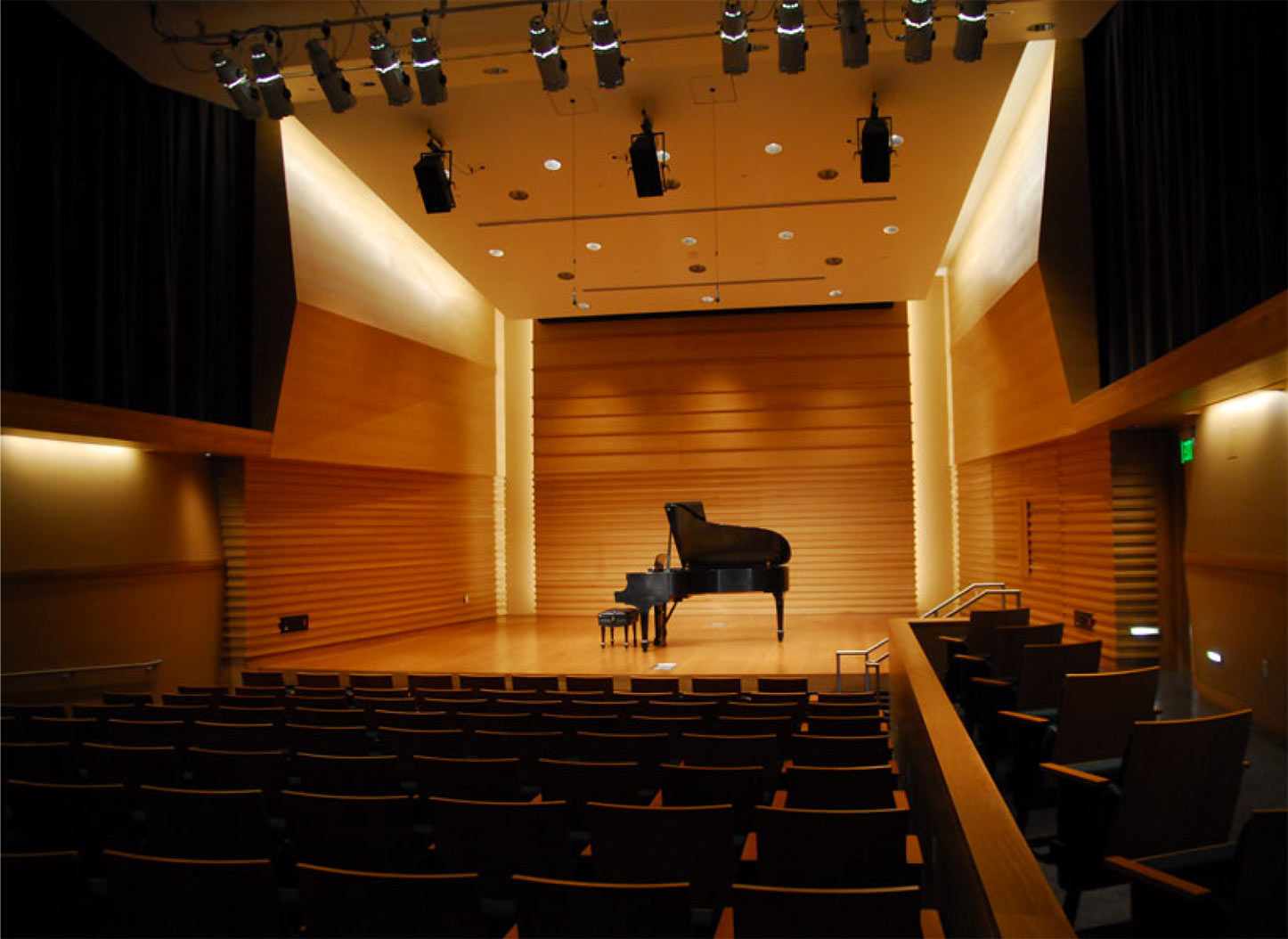 Barness Recital Hall is empty with a Steinway grand piano on the stage.