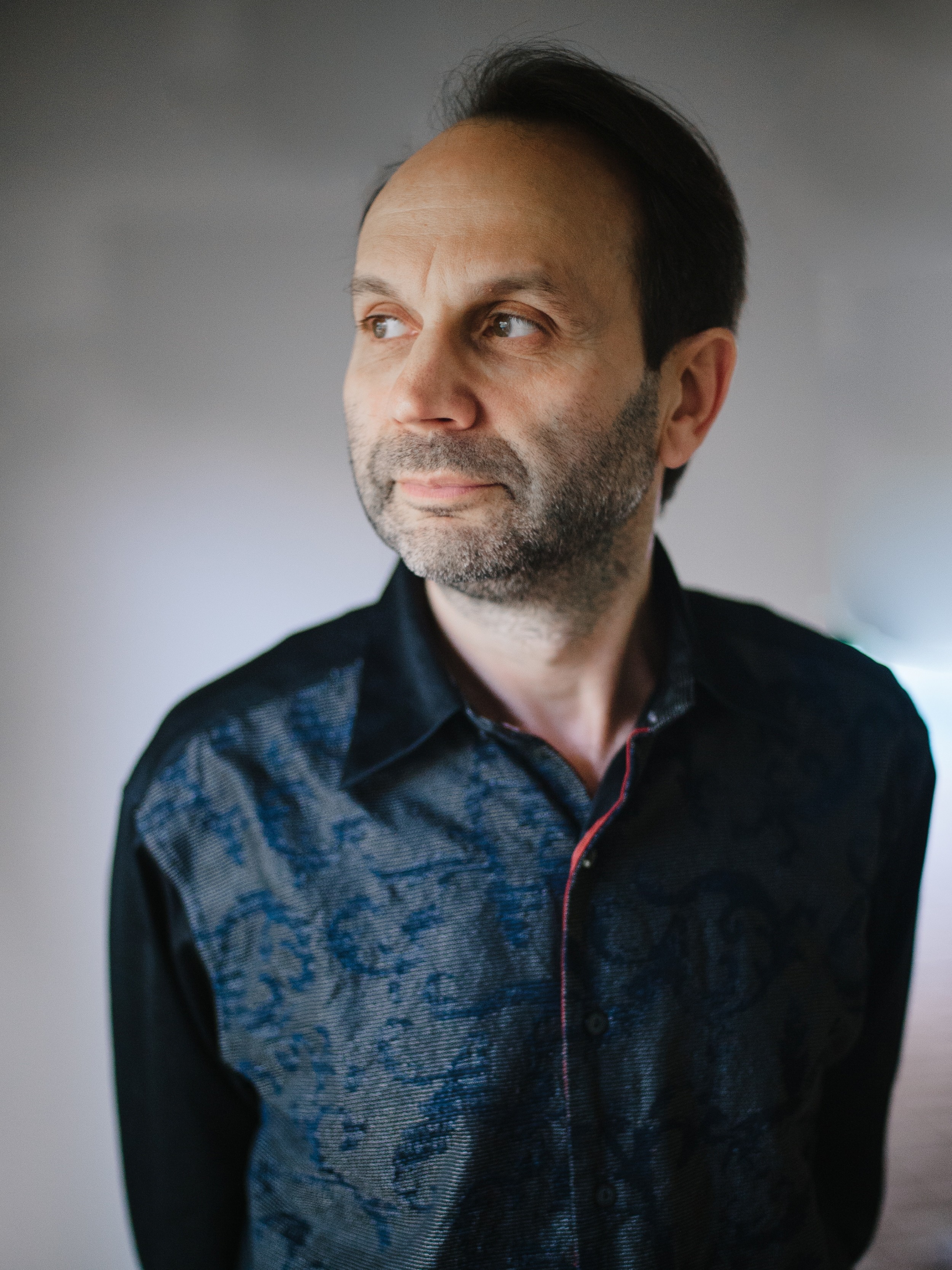 Svetozar Ivanov standing and looking out of frame.
