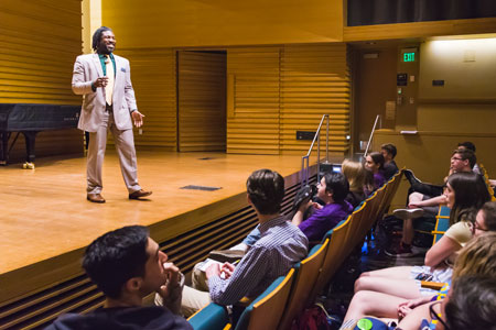 Dr. Dakeyan "Dre" Graham speaking at the School of Music.