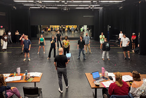 Student actors practice for 9-to-5: The Musical