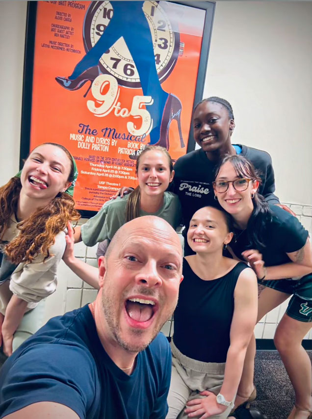 Student actors smiling.