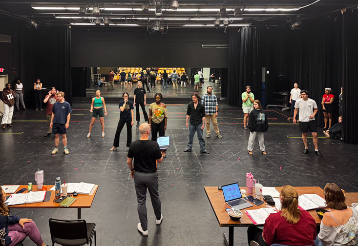 Student actors practice for 9-to-5: The Musical