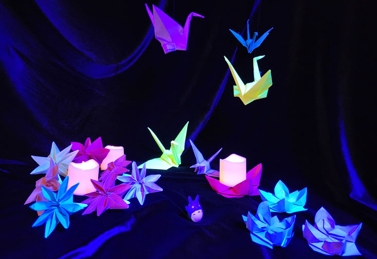 Brightly colored origami birds. - John Leduc, A Mother’s Gift, 2024. Courtesy of the artist.