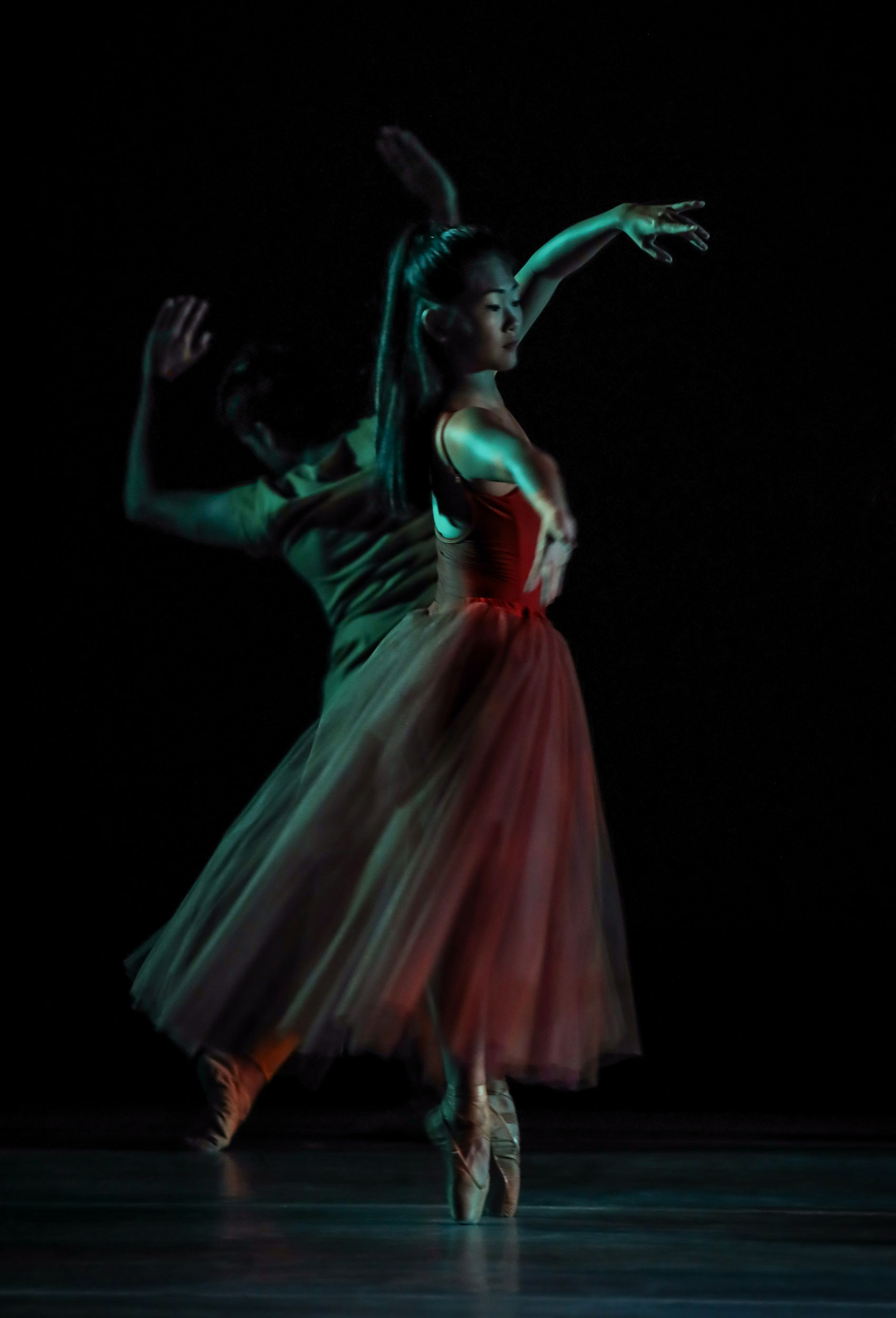 An Asian female dancer dances ballet.