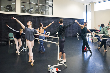 Students practicing ballet positions in class.