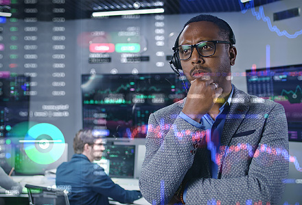 Person looking at screen with charts