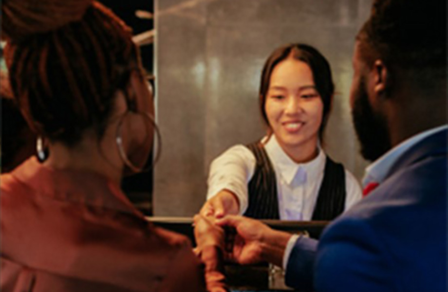 hotel worker helping customers