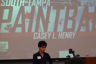 Casey Henry presenting at the competition