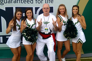 Andy Artis with Bulls cheerleaders