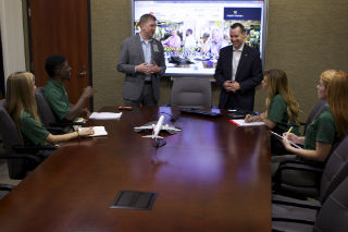 Professor Hooker and students working with Strickland