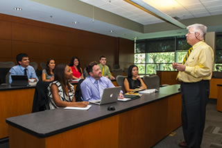 Grandon Gill speaking to students