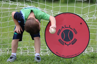 Child playing with baseball