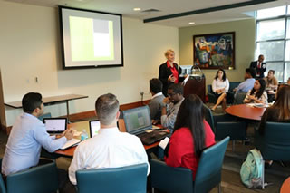 Students listening to presenter