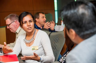 Attendees discussing a topic