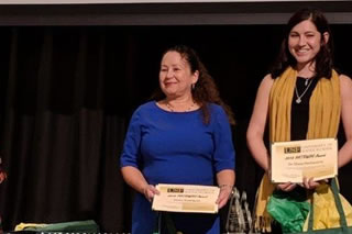 Eileen Rodriguez with award