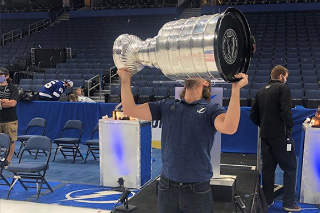Morgan holding Stanley Cup above his head