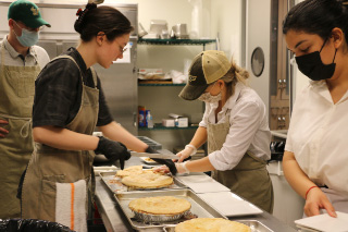 Students prepping slices of pie