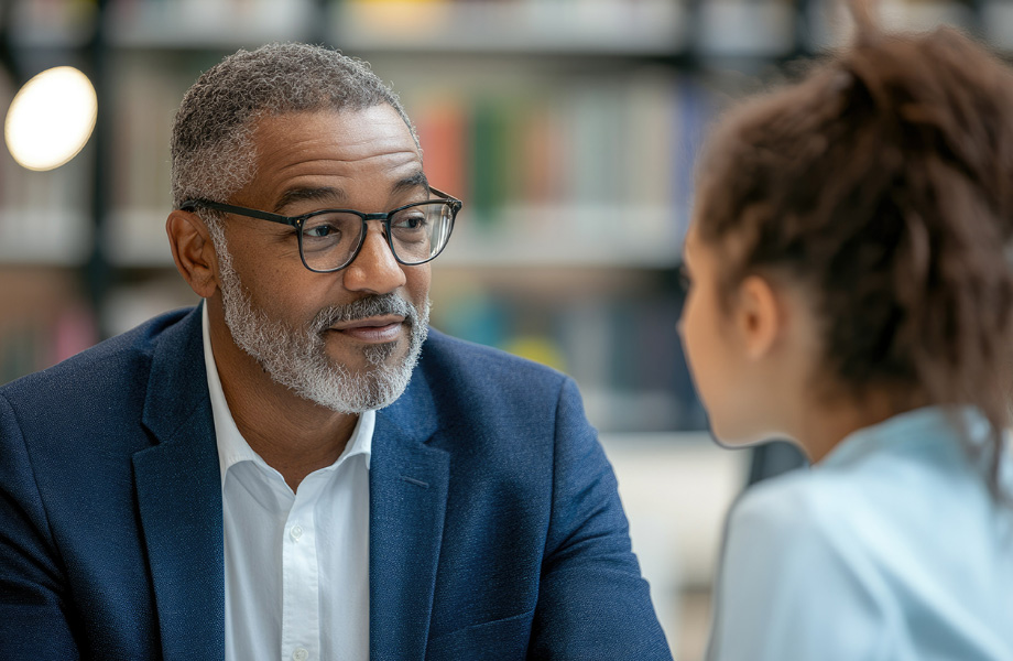 Mentor speaking to student