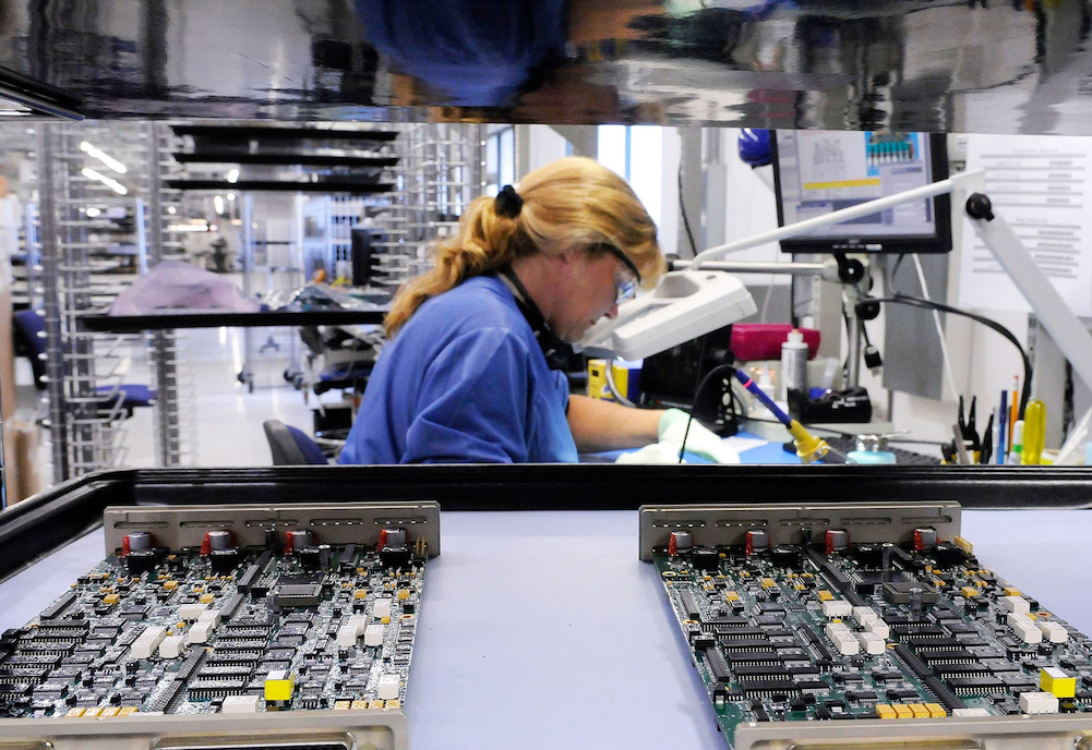 An image of a Jabil employee working on a production line