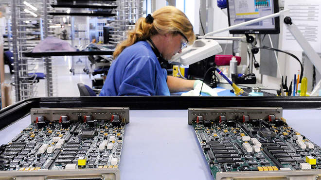 An image of a Jabil employee working on a production line