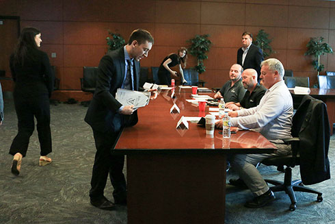 Students presenting to judges at a competition