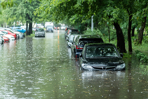 image of flooded street with cars