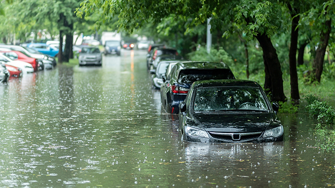 image of flooded street with cars