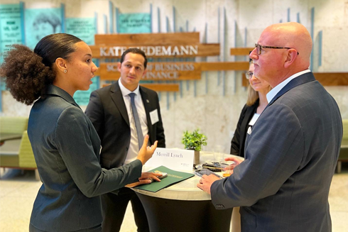 student makes connection while meeting with business professionals 