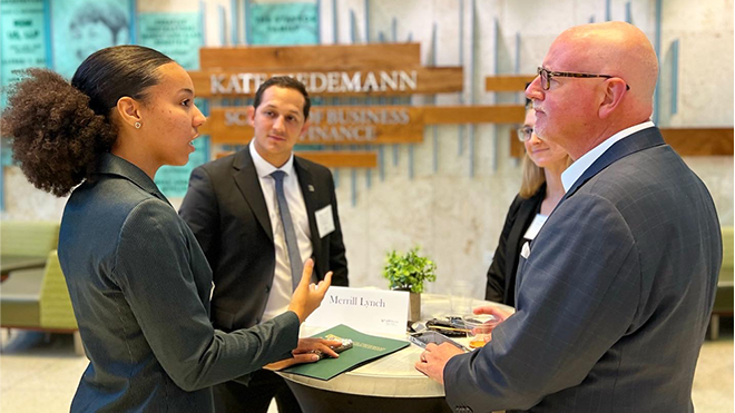 student networking with business professionals