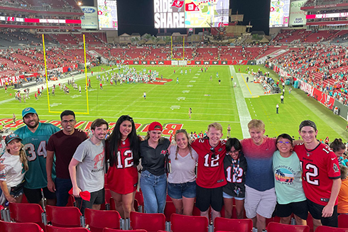Gopi Patel (fourth from right) and her classmates from University of South Florida (USF) at a Tampa Bay Buccaneers game. Patel is pursuing a two-year dual-degree program at USF, where students earn both an M.B.A. with a concentration in sport business and M.S. in sport and entertainment management. (Photograph courtesy Gopi Patel)
