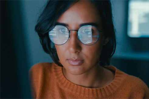 image of woman looking at screen