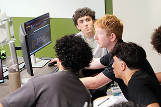 students work on the Bloomberg Terminals