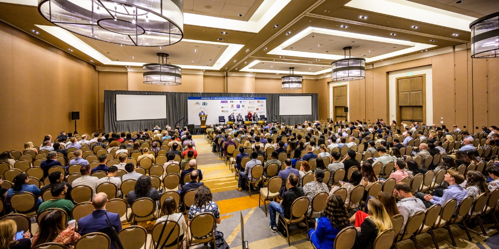 A wide shot showing the crowd and stage at the 2025 AIB conference.