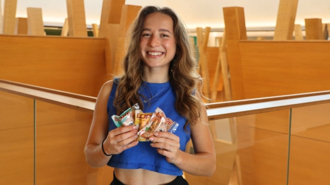 Image of Mira Stimac holding her energy bars