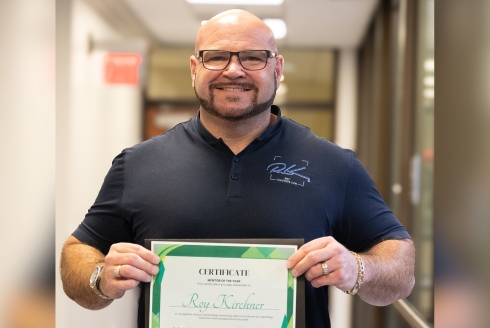 Roy Kirchner poses with his award