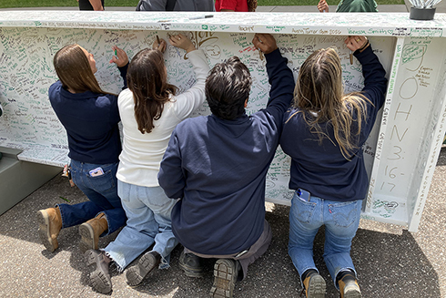 usf interns etch names into stadium beam