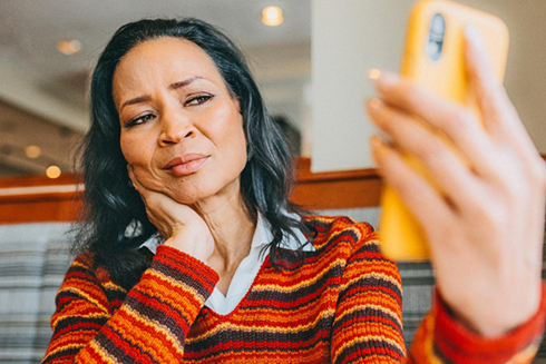 senior looking at a phone