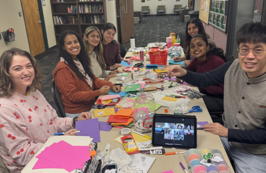 Students gathering together to make Valentine's Day cards