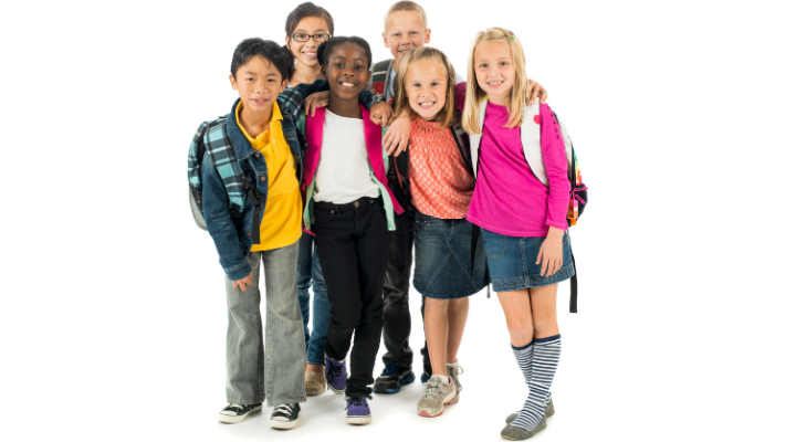 6 children with backpacks smiling