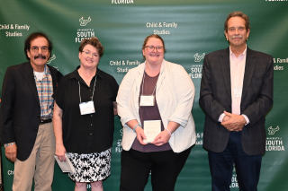 ITRE faculty and student at 2025 Graduation