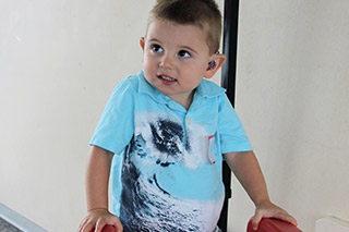 boy patient with hearing aids