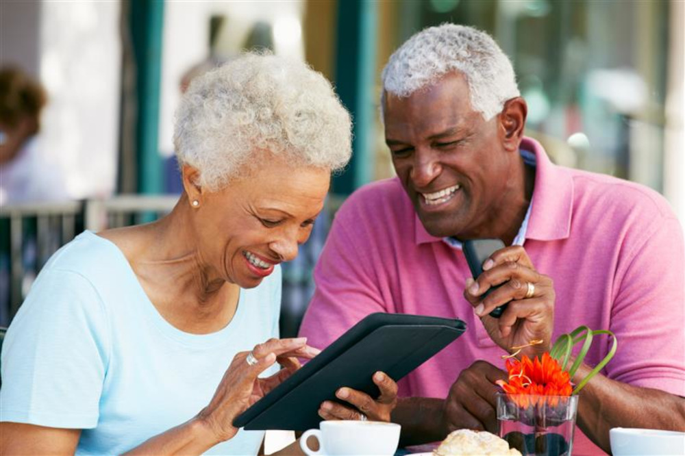 Smiling couple using a phone together