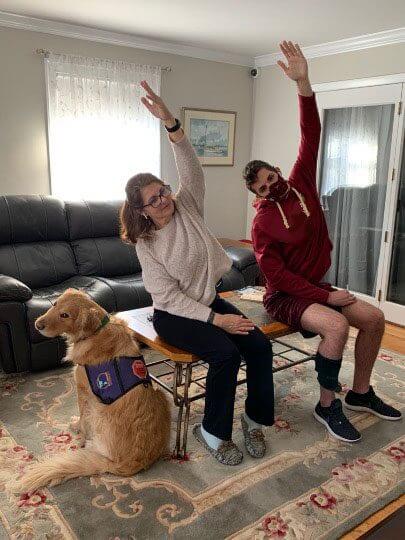 A student and therapy dog in a yoga session