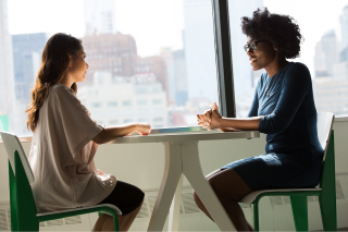 Two women talking 