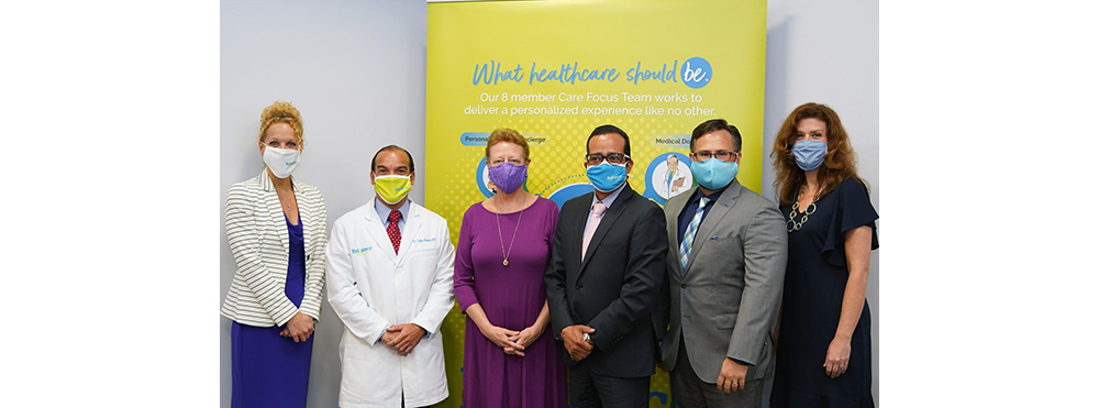 "What healthcare should be" poster with six masked persons standing in front