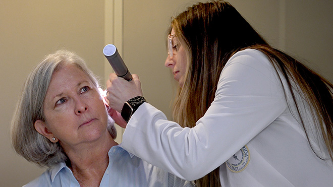 Audiologist conducting a hearing exam