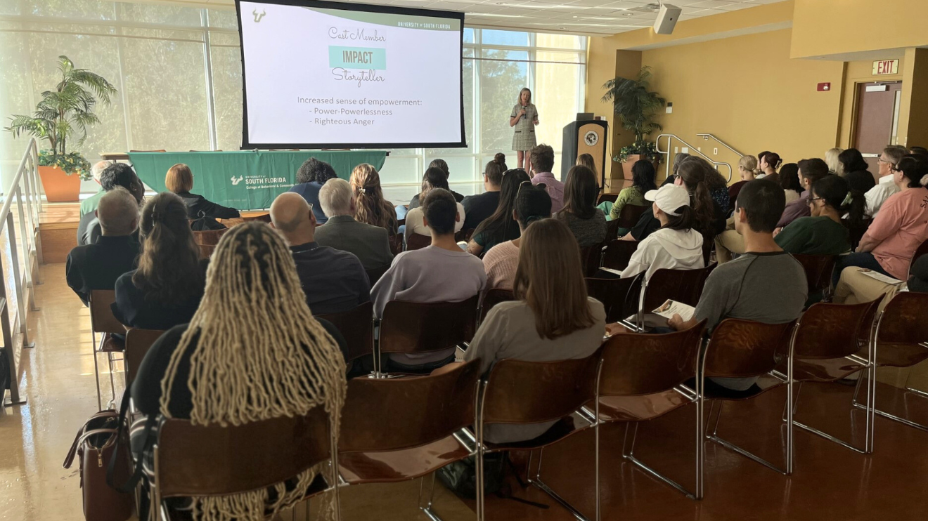Dr. Kosyluk presents to a group of attendees at the FMHI fall colloquium.