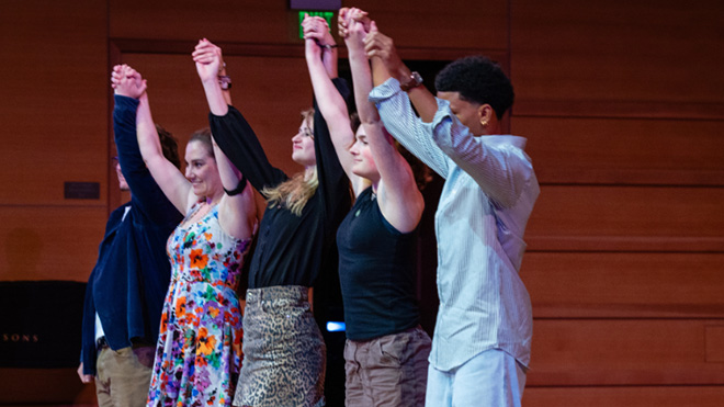 Students bow at the conclusion of the performance