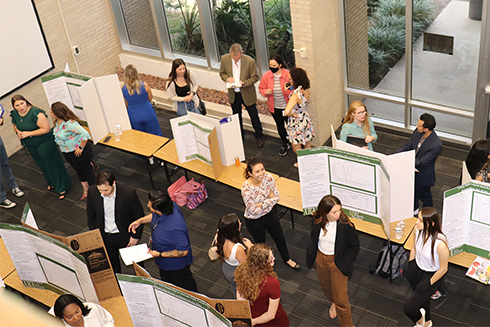 students in MHC atrium during poster expo