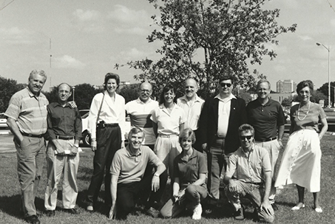 Group of criminology faculty members standing outside at a tree dedication